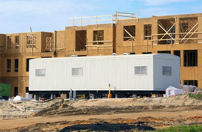 crane lifting modular building for construction office rentals in San Rafael